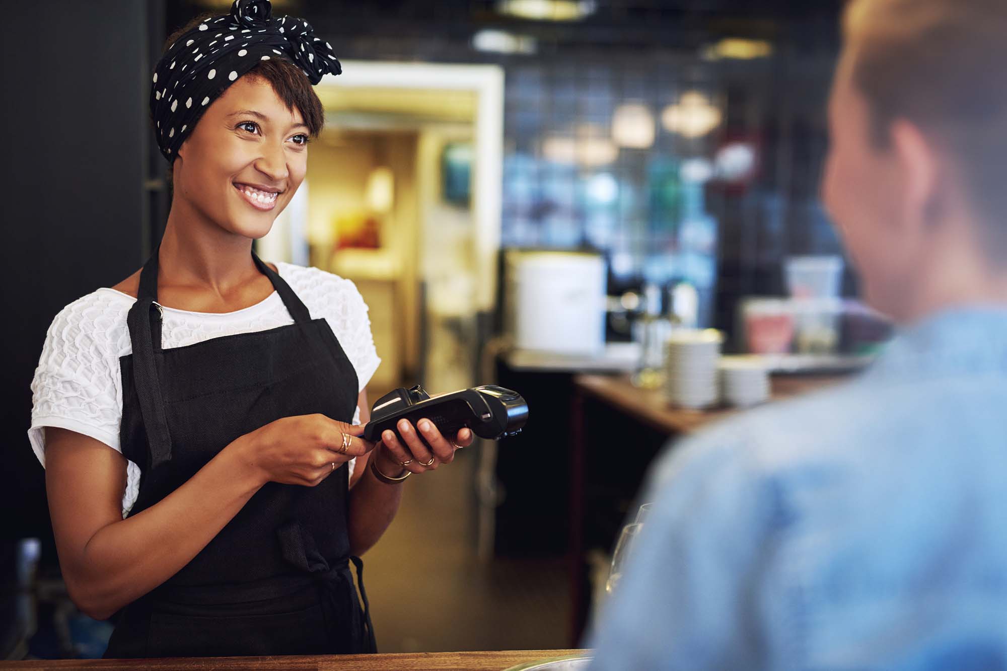 Business woman taking payment